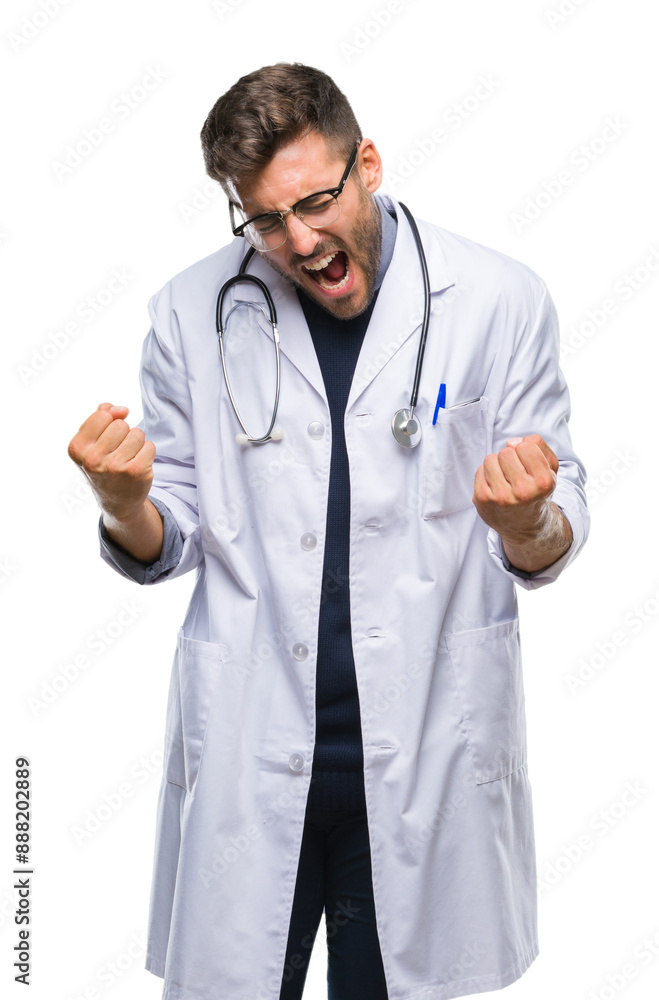 Young handsome doctor man over isolated background very happy and excited doing winner gesture with arms raised, smiling and screaming for success. Celebration concept. Young handsome doctor man over isolated background very happy and excited doing winner gesture with arms raised, smiling and screaming for success. Celebration concept.