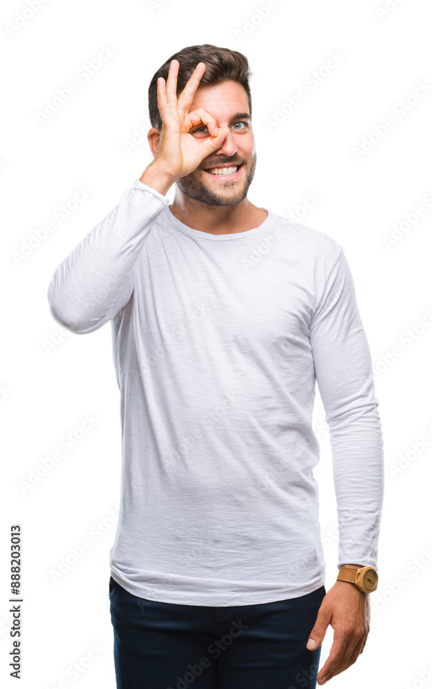Young handsome man over isolated background doing ok gesture with hand smiling, eye looking through fingers with happy face. Young handsome man over isolated background doing ok gesture with hand smiling, eye looking through fingers with happy face.