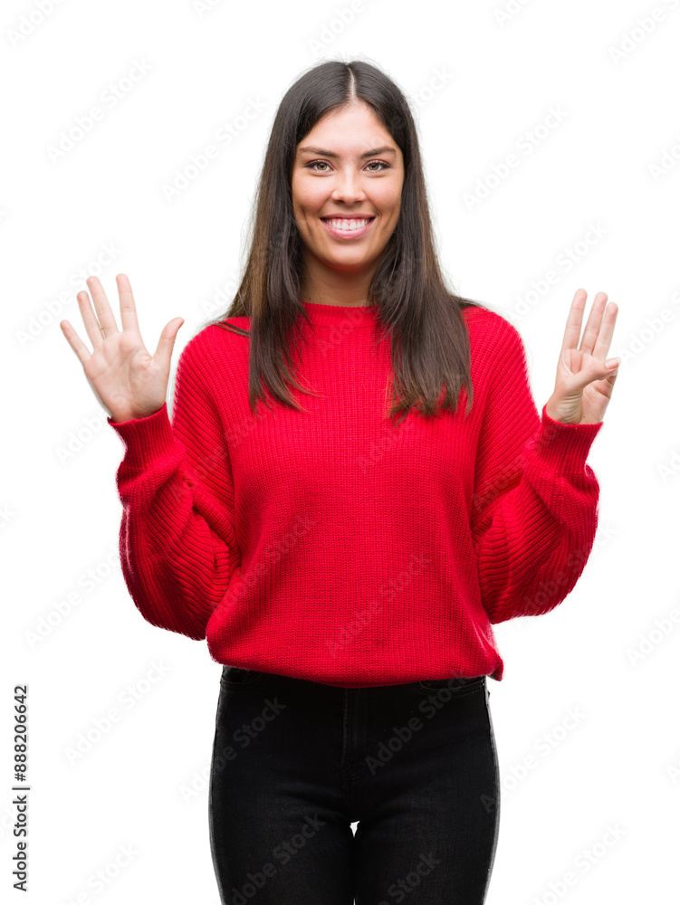 Young beautiful hispanic wearing red sweater showing and pointing up with fingers number eight while smiling confident and happy. Young beautiful hispanic wearing red sweater showing and pointing up with fingers number eight while smiling confident and happy.