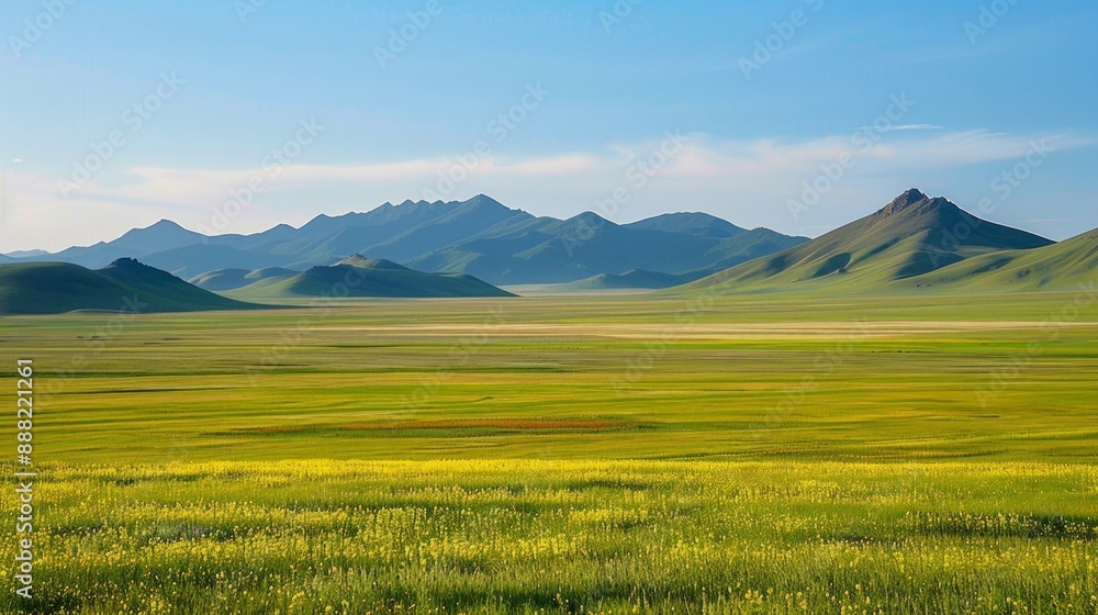 Expansive green valley with mountains in the distance on a sunny day Expansive green valley with mountains in the distance on a sunny day