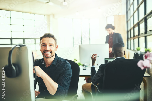 Portrait, mature businessman and computer in office in coworking in digital agency as brand designer. Male person, smile and tech as colleagues for teamwork, collaboration or deadline with confidence © peopleimages.com