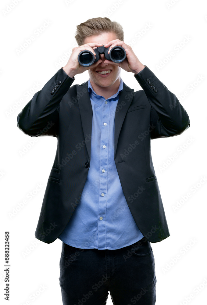 Young handsome blond man looking through binoculars with a happy face standing and smiling with a confident smile showing teeth Young handsome blond man looking through binoculars with a happy face standing and smiling with a confident smile showing teeth