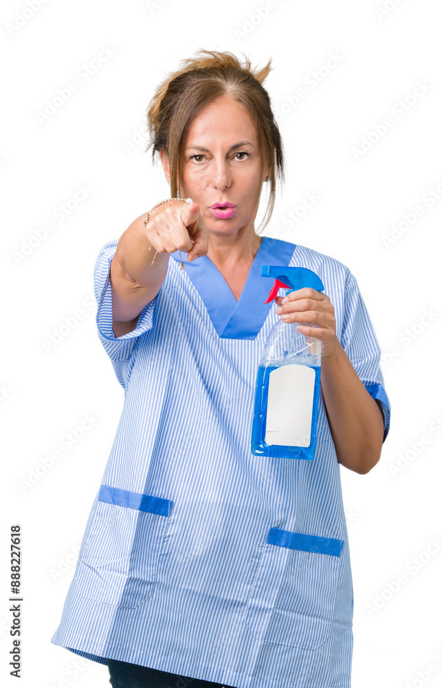 Middle age brunette cleaner woman wearing housework uniform over isolated background pointing with finger to the camera and to you, hand sign, positive and confident gesture from the front Middle age brunette cleaner woman wearing housework uniform over isolated background pointing with finger to the camera and to you, hand sign, positive and confident gesture from the front