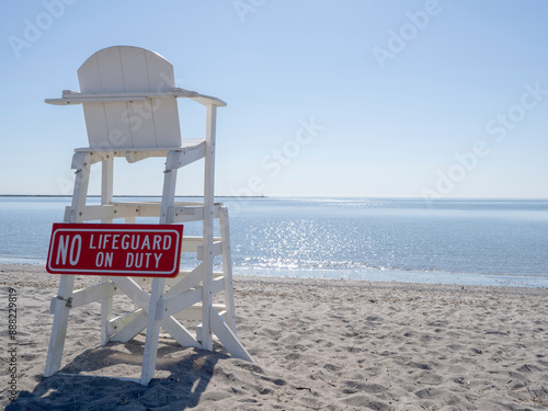 Empty lifeguard chair at Short Beach in Stratford Connecticut during the day. 