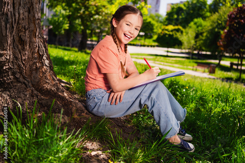 Fotografie Full length photo of adorable little girl have fun outside activity sit under tr