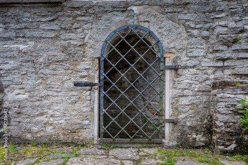 Obraz na płótnie Wrought iron door on limestone wall