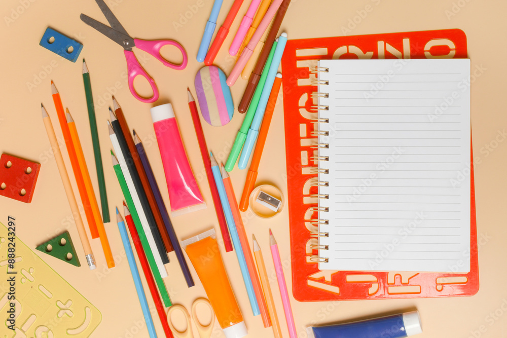 Back to school concept with variety of office and school supplies on yellow background. Back to school concept with variety of office and school supplies on yellow background.