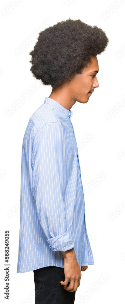 Young african american man with afro hair looking to side, relax profile pose with natural face with confident smile. Young african american man with afro hair looking to side, relax profile pose with natural face with confident smile.
