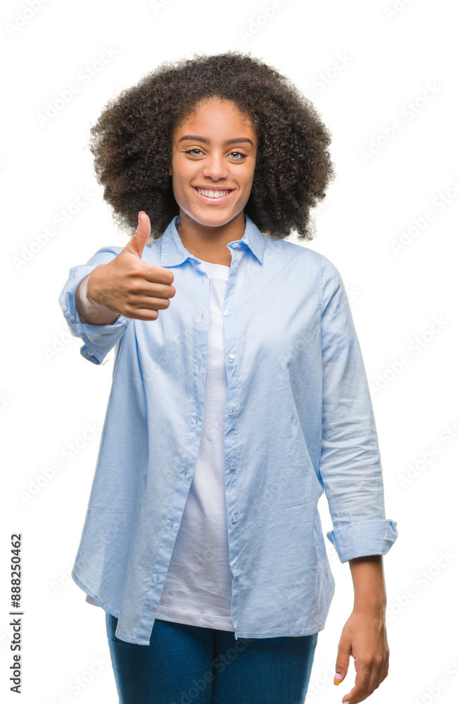 Young afro american woman over isolated background doing happy thumbs up gesture with hand. Approving expression looking at the camera with showing success. Young afro american woman over isolated background doing happy thumbs up gesture with hand. Approving expression looking at the camera with showing success.