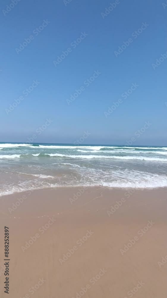 Tropical beach sea sand and sky. Landscape view of beach sea in summer day. Beach space area. At Israel Beach, Tel Aviv, Israel - July 17 2024. Video Clip. Sea shore Tropical beach sea sand and sky. Landscape view of beach sea in summer day. Beach space area. At Israel Beach, Tel Aviv, Israel - July 17 2024. Video Clip. Sea shore