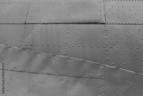 Fotografie A close-up of the fuselage of an old military airplane.