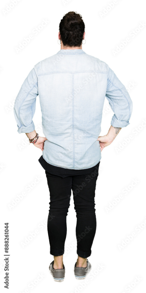 Young hipster man with long hair and beard wearing glasses standing backwards looking away with arms on body Young hipster man with long hair and beard wearing glasses standing backwards looking away with arms on body