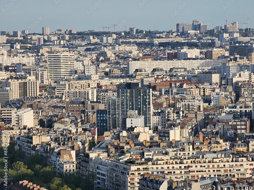 Paris, France - April 12, 2024: Aerial view of Paris skyline with dense urban sprawl and modern skyscrapers, Ile de France, France.  Amazing mix between modern skyscraoers and old buildings.