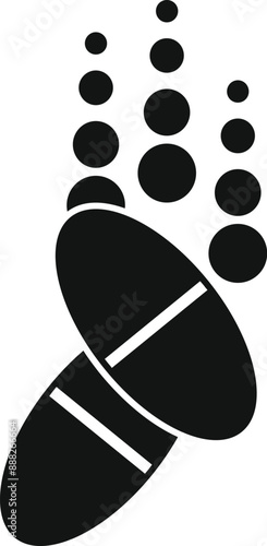 Simple black icon of two pills falling with round particles