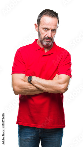 Middle age hoary senior man over isolated background skeptic and nervous, disapproving expression on face with crossed arms. Negative person.