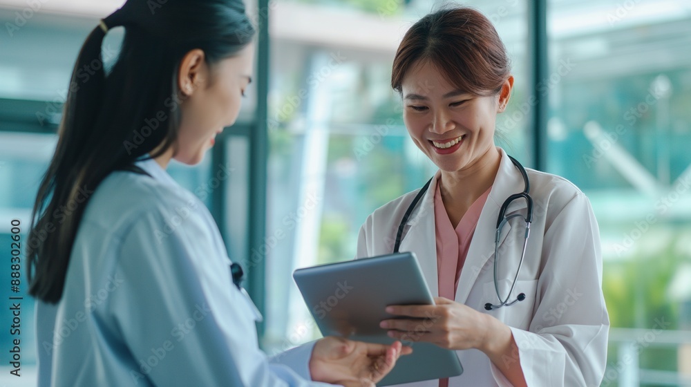 Doctor consultation with the patient by using digital tablet, female doctor with tablet computer talking to woman Doctor consultation with the patient by using digital tablet, female doctor with tablet computer talking to woman