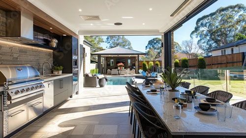 suburban contemporary home with a luxury outdoor kitchen, perfect for entertaining guests in a stylish, modern setting