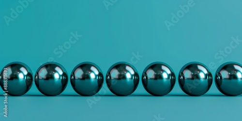 Row of teal spheres on a turquoise background.