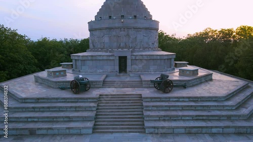 Aerial view of The Mausoleum of  Heroes of World War I from Marasesti, Romania. Photography was taken from a drone at a lower altitude at sunset, flying backwards with the building in the view.
