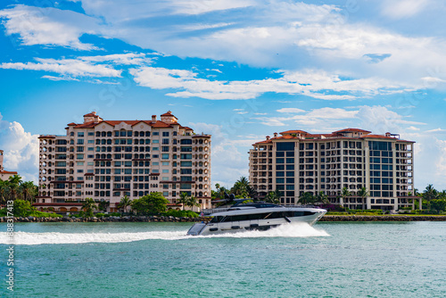 Fisher Island travel destination. Yacht in Miami beach. Luxury lifestyle. Summer vacation. A luxury motor yacht. Miami yachting. Yacht vacation in summer. Luxury yacht in Miami. Private luxury boat photo