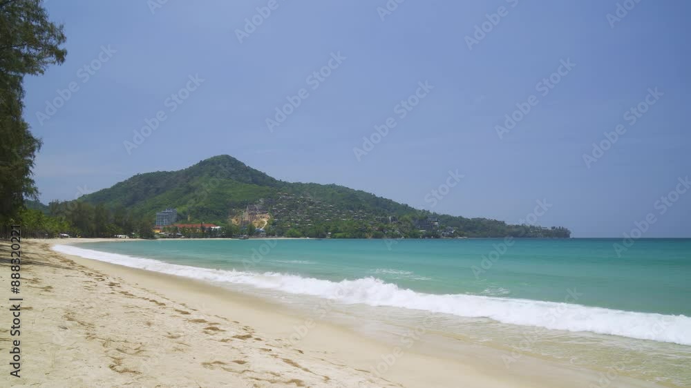 Tranquil Kamala Beach with gentle waves and scenic hills, Phuket, Thailand Tranquil Kamala Beach with gentle waves and scenic hills, Phuket, Thailand