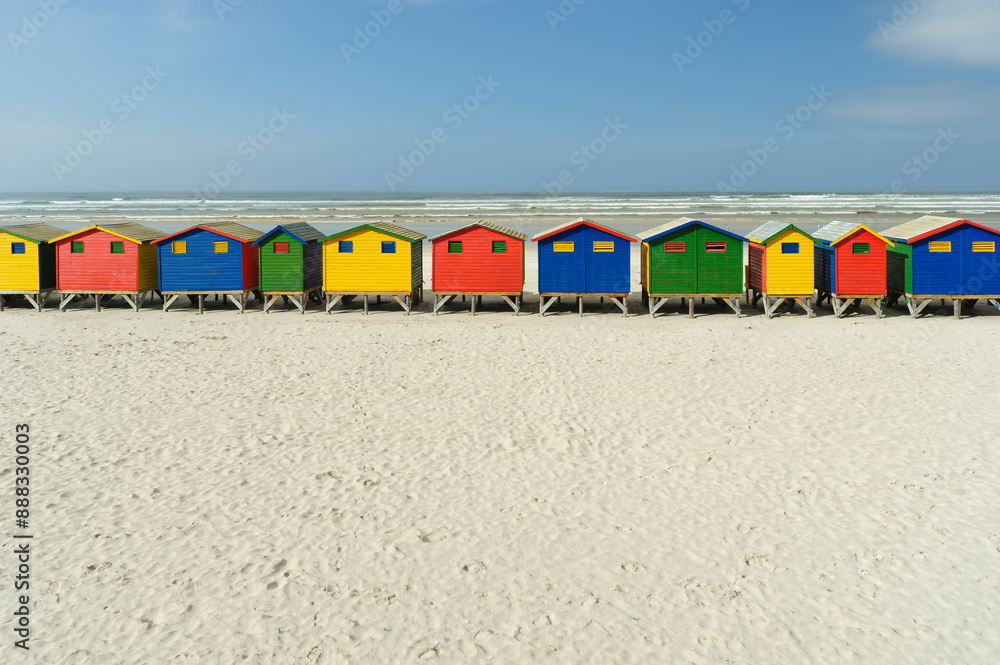 Colourful beach huts on a Beach with the sky and ocean backdrop Colourful beach huts on a Beach with the sky and ocean backdrop