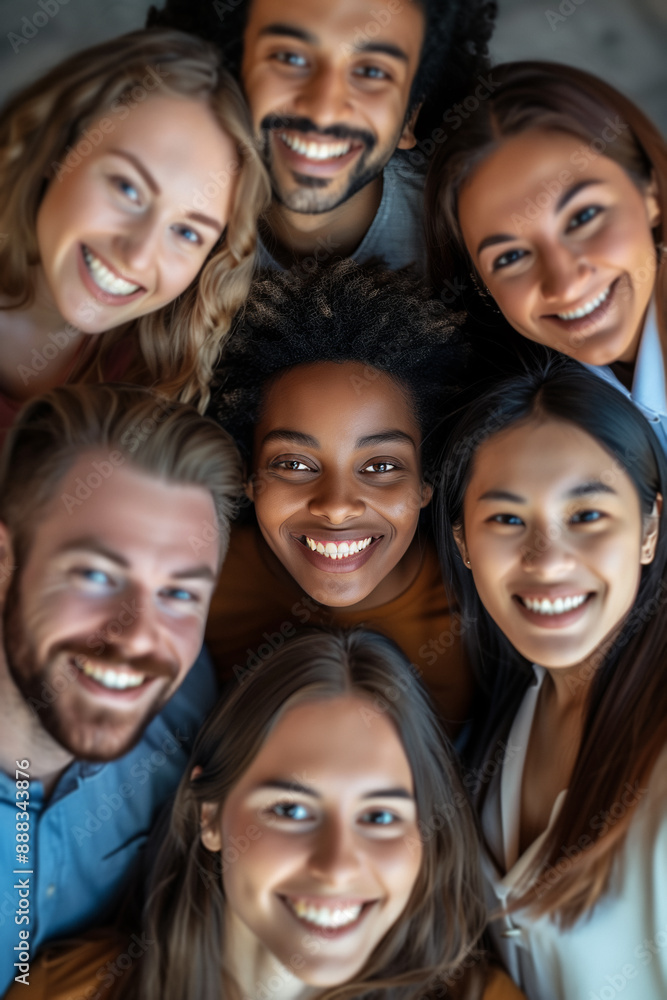 A diverse group of smiling people looking up at the camera in a close-up shot This image captures joy, togetherness, and diversity from a top-down perspective A diverse group of smiling people looking up at the camera in a close-up shot This image captures joy, togetherness, and diversity from a top-down perspective