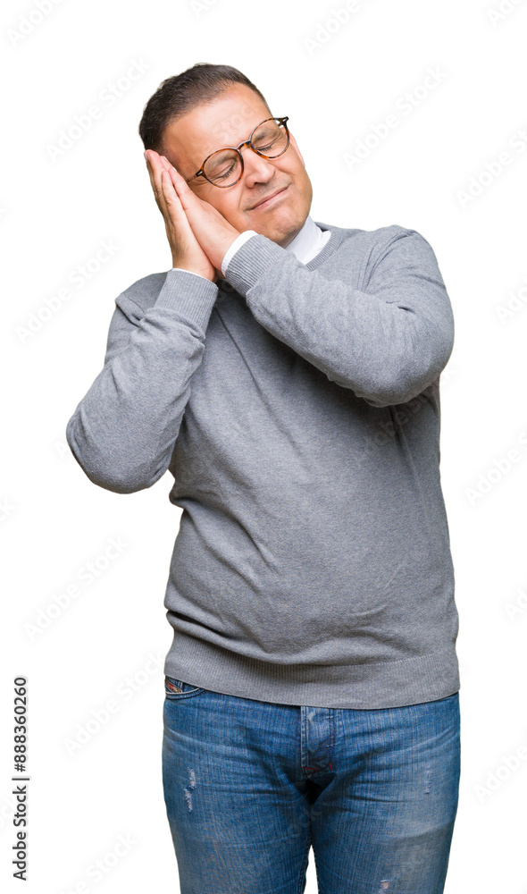 Middle age bussines arab man wearing glasses over isolated background sleeping tired dreaming and posing with hands together while smiling with closed eyes. Middle age bussines arab man wearing glasses over isolated background sleeping tired dreaming and posing with hands together while smiling with closed eyes.