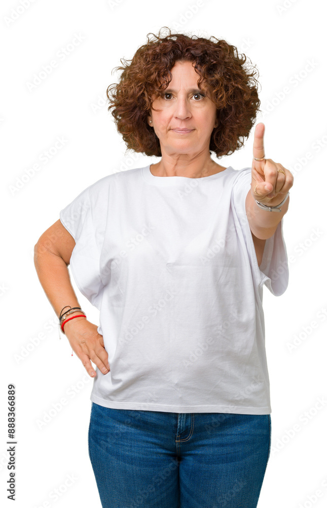 Beautiful middle ager senior woman wearing white t-shirt over isolated background Pointing with finger up and angry expression Beautiful middle ager senior woman wearing white t-shirt over isolated background Pointing with finger up and angry expression