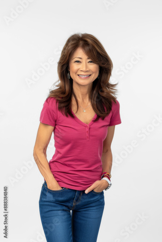 Smiling Woman in Pink Shirt Supporting Breast Cancer Awareness © Ángela Rojas