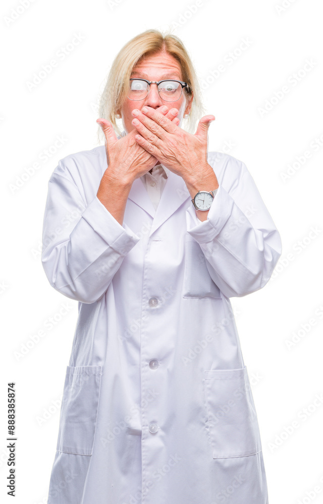 Middle age blonde therapist woman wearing white coat over isolated background shocked covering mouth with hands for mistake. Secret concept. Middle age blonde therapist woman wearing white coat over isolated background shocked covering mouth with hands for mistake. Secret concept.