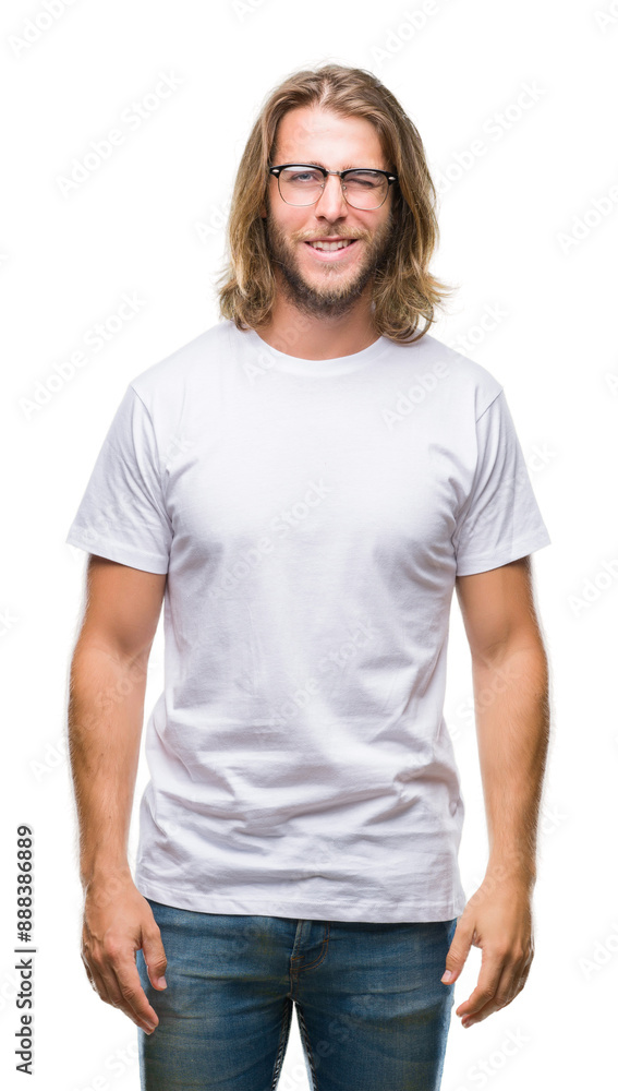 Young handsome man with long hair wearing glasses over isolated background winking looking at the camera with sexy expression, cheerful and happy face. Young handsome man with long hair wearing glasses over isolated background winking looking at the camera with sexy expression, cheerful and happy face.