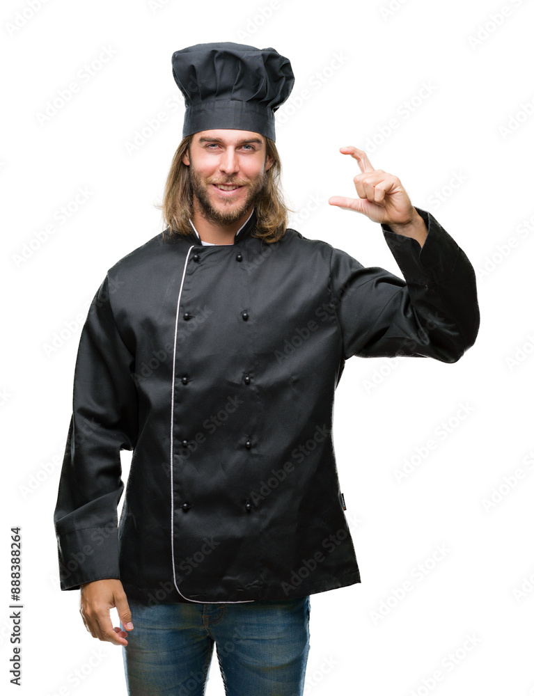 Young handsome cook man with long hair over isolated background smiling and confident gesturing with hand doing size sign with fingers while looking and the camera. Measure concept. Young handsome cook man with long hair over isolated background smiling and confident gesturing with hand doing size sign with fingers while looking and the camera. Measure concept.