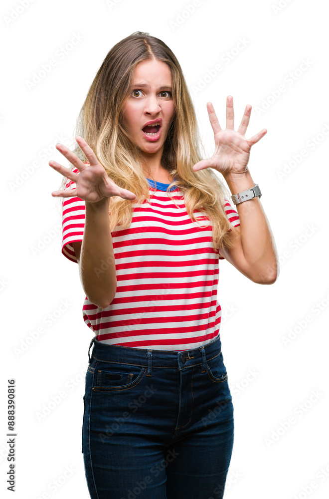 Obraz premium Young beautiful blonde woman over isolated background afraid and terrified with fear expression stop gesture with hands, shouting in shock. Panic concept.