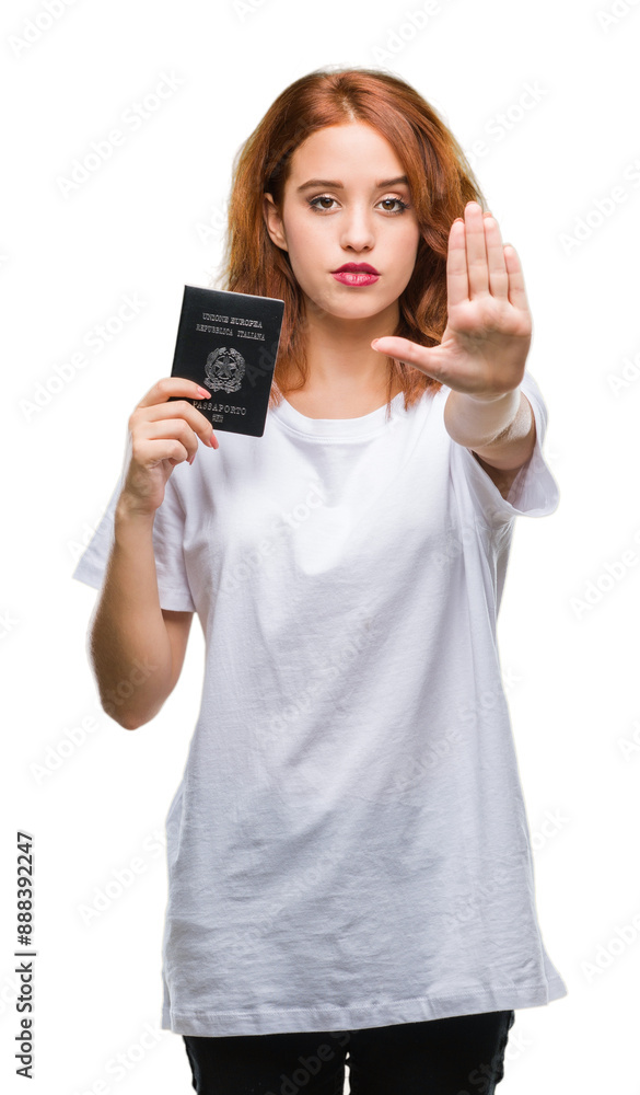 Young beautiful woman holding passport of italy over isolated background with open hand doing stop sign with serious and confident expression, defense gesture Young beautiful woman holding passport of italy over isolated background with open hand doing stop sign with serious and confident expression, defense gesture