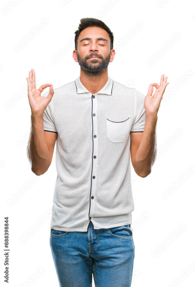 Adult hispanic man over isolated background relax and smiling with eyes closed doing meditation gesture with fingers. Yoga concept. Adult hispanic man over isolated background relax and smiling with eyes closed doing meditation gesture with fingers. Yoga concept.