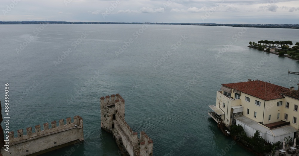 Scaliger castle in the historical center of Sirmione town near Garda lake in Italy. Scaliger castle in the historical center of Sirmione town near Garda lake in Italy.
