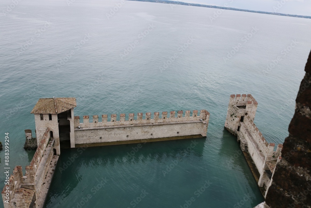 Scaliger castle in the historical center of Sirmione town near Garda lake in Italy. Scaliger castle in the historical center of Sirmione town near Garda lake in Italy.