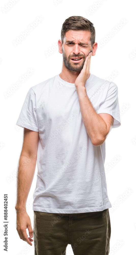 Young handsome man over isolated background touching mouth with hand with painful expression because of toothache or dental illness on teeth. Dentist concept. Young handsome man over isolated background touching mouth with hand with painful expression because of toothache or dental illness on teeth. Dentist concept.