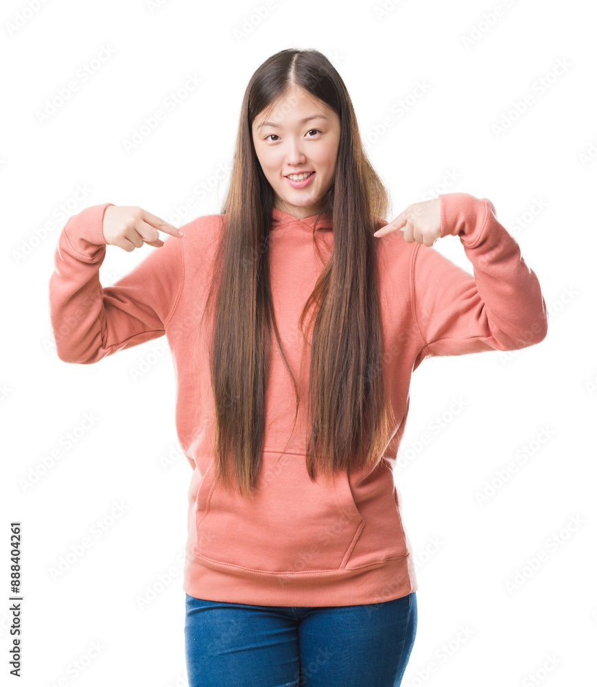 Young Chinese woman over isolated background wearing sport sweathshirt looking confident with smile on face, pointing oneself with fingers proud and happy. Young Chinese woman over isolated background wearing sport sweathshirt looking confident with smile on face, pointing oneself with fingers proud and happy.