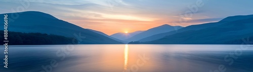 Obraz na płótnie Serene sunrise over a peaceful lake with mountains in the background, creating a tranquil and picturesque landscape. w salonie