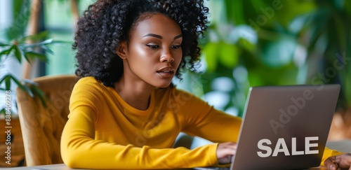 Woman Browsing Online Sales on Laptop in Home Office