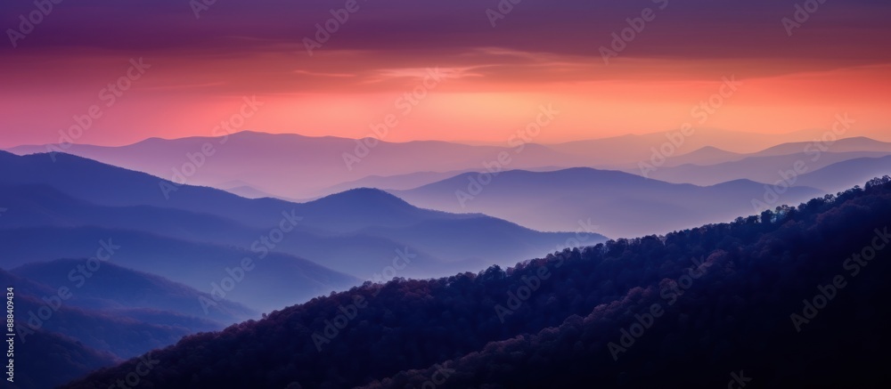 Fototapeta premium Serene Sunset Over Mountain Ranges