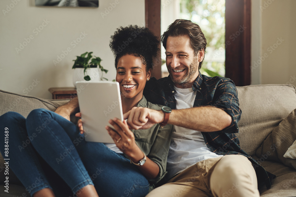 Interracial couple, tablet and happy in home for shopping, choice and decision together on sofa. Man, woman and tech on couch for wedding ideas, brainstorming and ecommerce in living room on website Interracial couple, tablet and happy in home for shopping, choice and decision together on sofa. Man, woman and tech on couch for wedding ideas, brainstorming and ecommerce in living room on website
