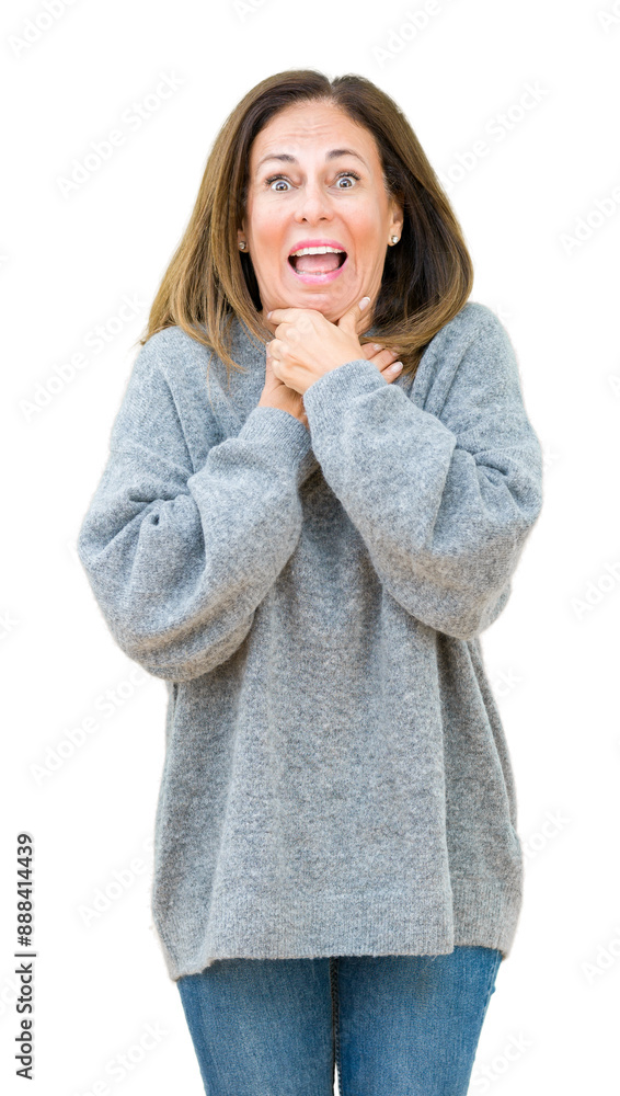 Beautiful middle age woman wearing winter sweater over isolated background shouting and suffocate because painful strangle. Health problem. Asphyxiate and suicide concept. Beautiful middle age woman wearing winter sweater over isolated background shouting and suffocate because painful strangle. Health problem. Asphyxiate and suicide concept.
