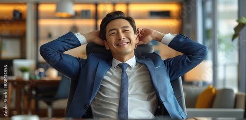 Smiling Businessman Relaxing in Office Chair During Daytime