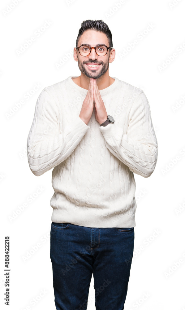 Young handsome man wearing glasses over isolated background praying with hands together asking for forgiveness smiling confident. Young handsome man wearing glasses over isolated background praying with hands together asking for forgiveness smiling confident.