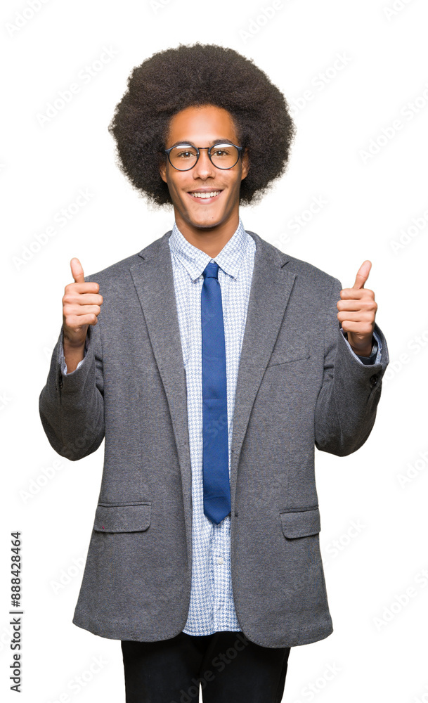 Young african american business man with afro hair wearing glasses success sign doing positive gesture with hand, thumbs up smiling and happy. Looking at the camera with cheerful expression. Young african american business man with afro hair wearing glasses success sign doing positive gesture with hand, thumbs up smiling and happy. Looking at the camera with cheerful expression.