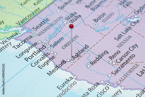Close up to a Ashland city with a red pin needle into United States of America country political map 