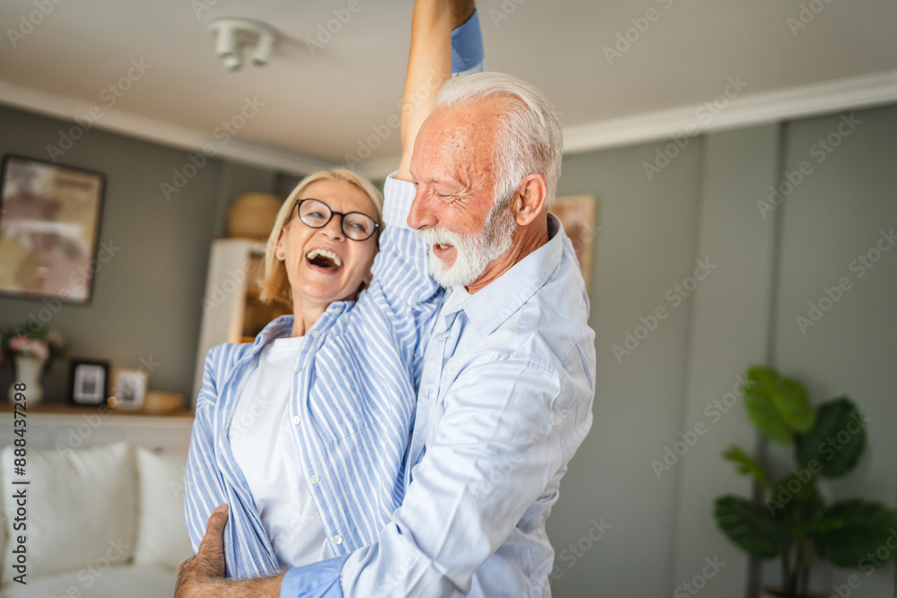 Senior active couple husband and wife dance and enjoy together at home Senior active couple husband and wife dance and enjoy together at home